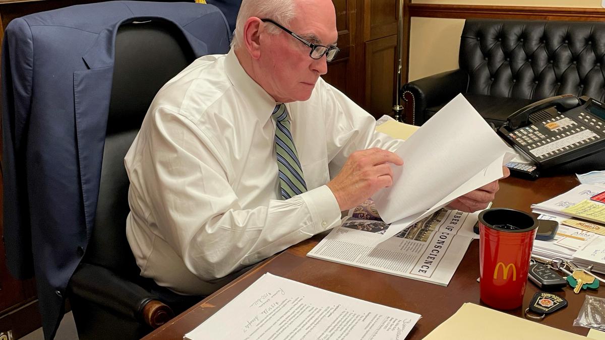 Rep. Kelly reading over the text of a bill in his Washington, D.C. office.