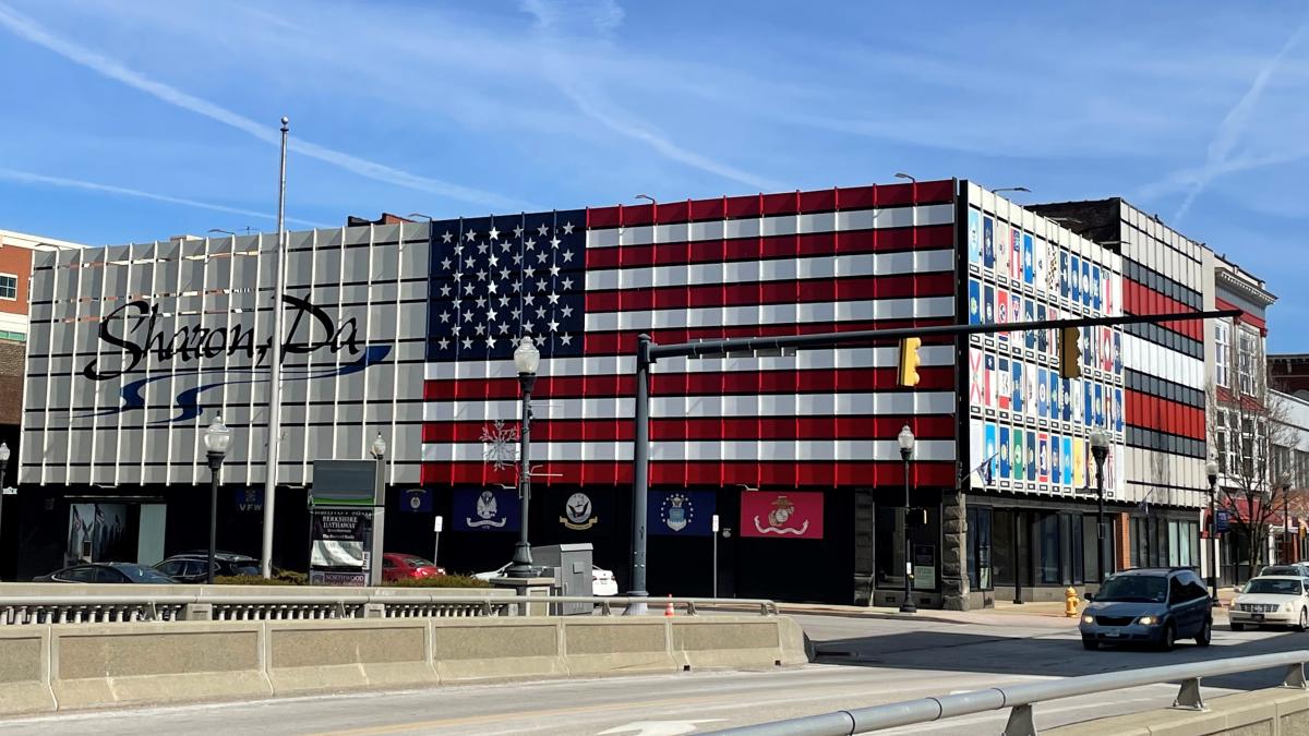 Building with sign Sharon, Pa written across with Flag